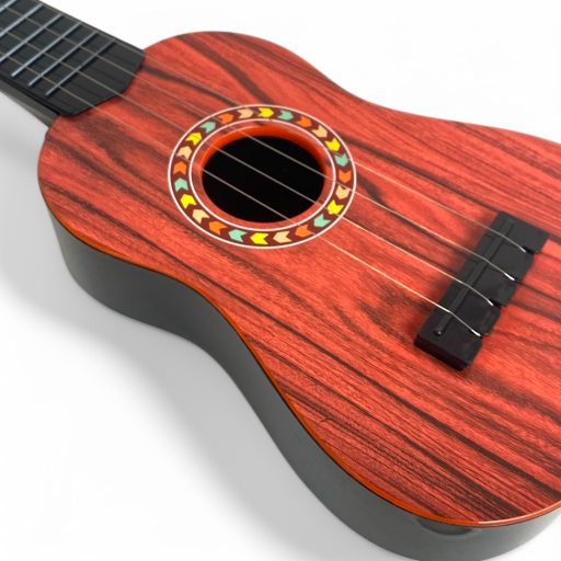 Gyermek gitár, 4 húros, 3 színben, 15x46 cm méretben.